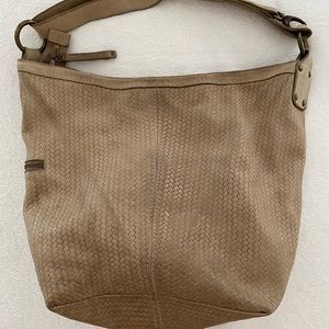 Roots “Edie” woven shoulder bag